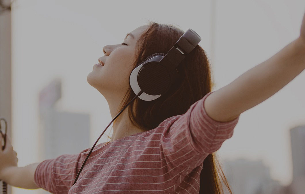 lady listening to music rooftop