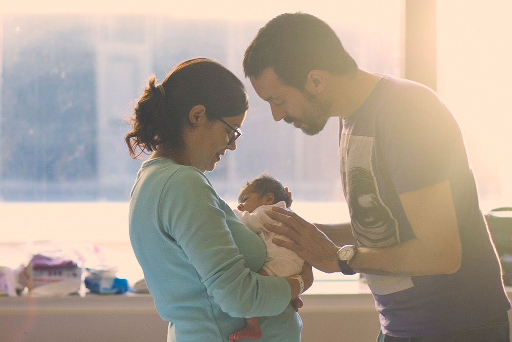 parents with new born baby