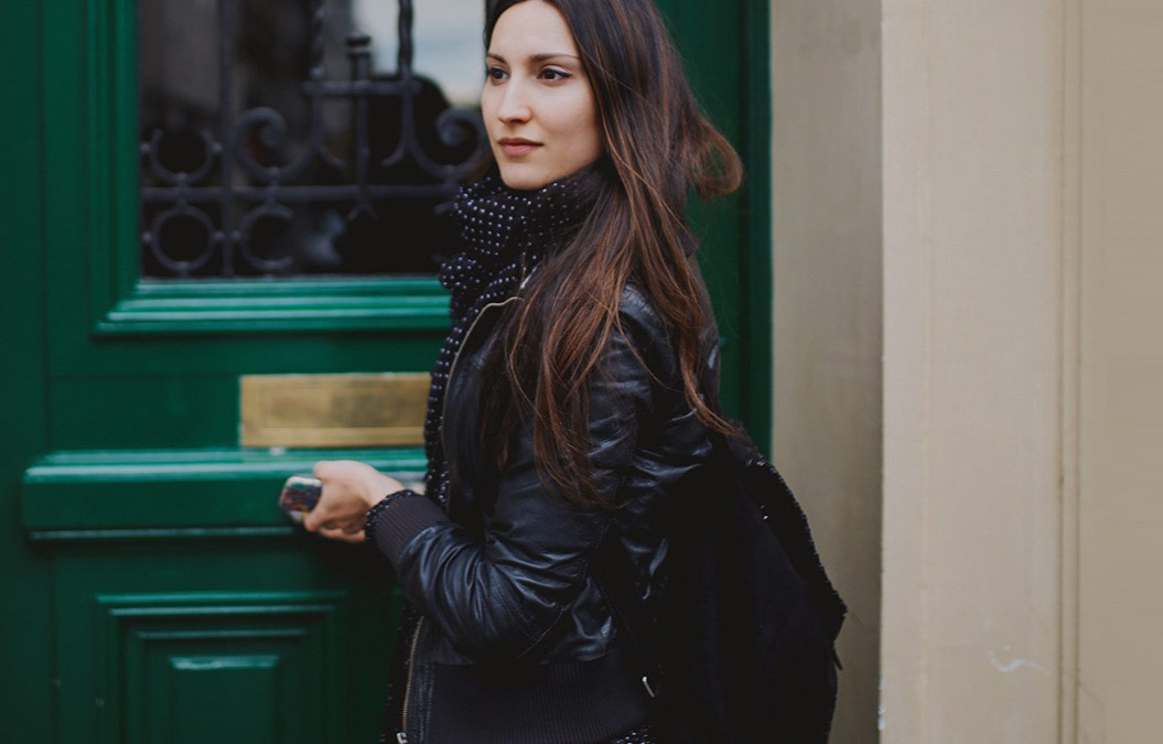 woman in front of her apartment 