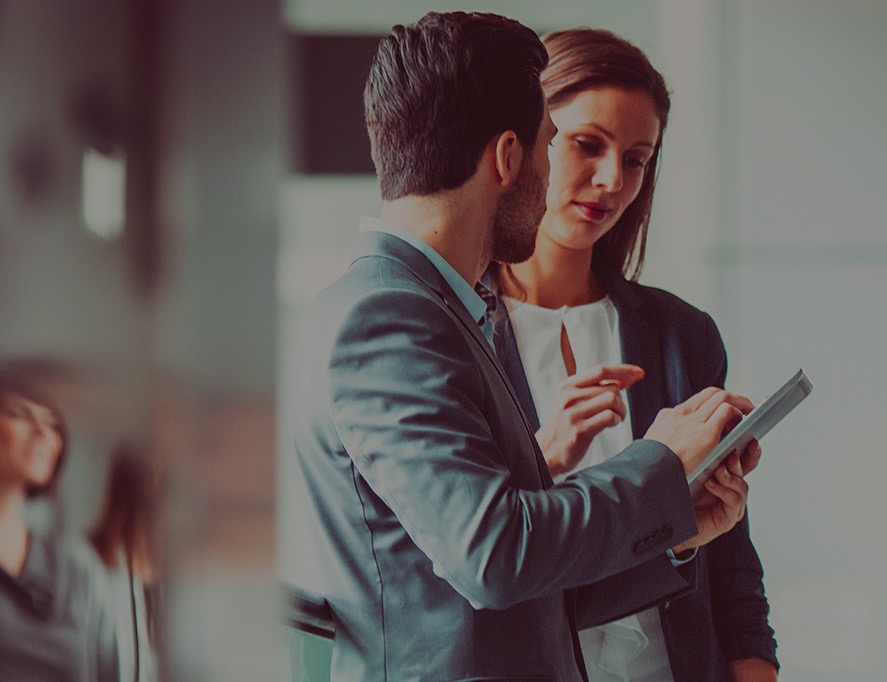 businessman and woman using tablet 